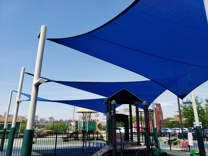 Playground shade sails create a safe and cool outdoor space for children.