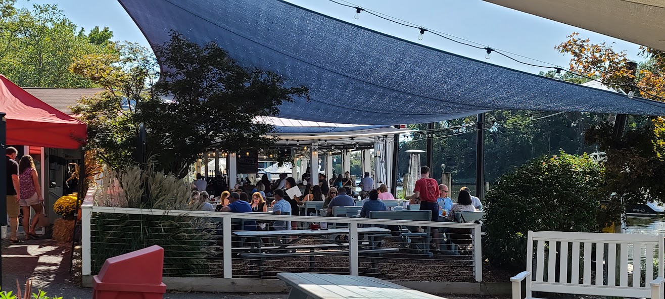 Discover Comfort: Customers enjoying shaded area whilst dining.