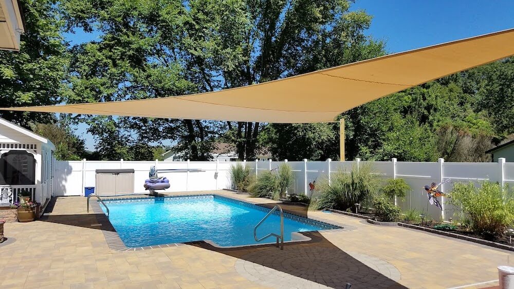 Shade Sail Installation for a Swimming Pool at Home